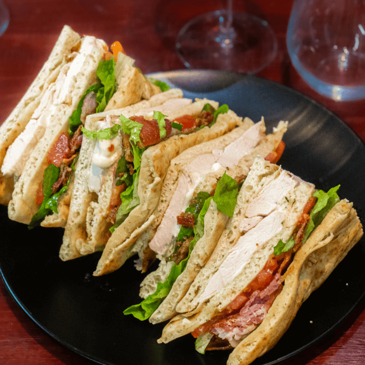 chicken club sandwich on flatbread